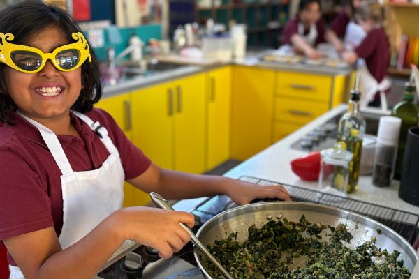 A child making palak paneer