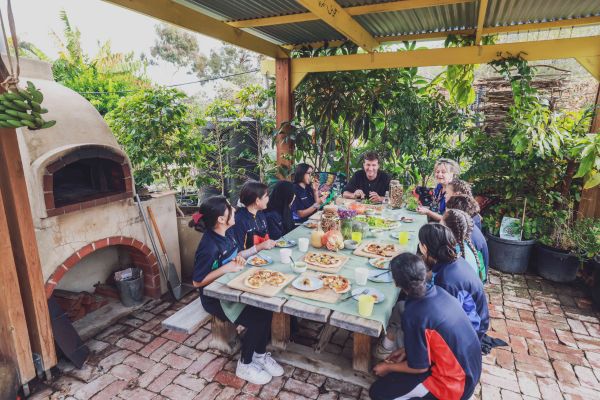 Children and educators sharing a meal