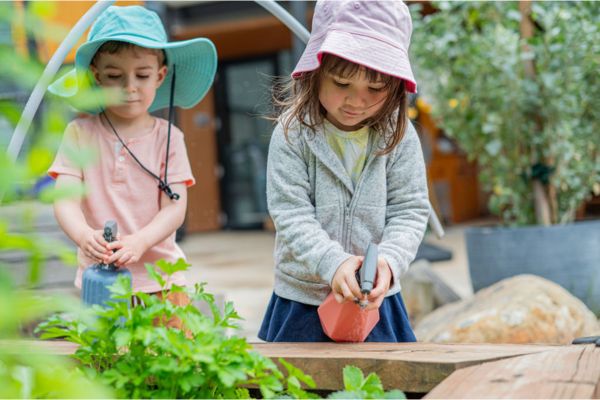 Children watering a garden