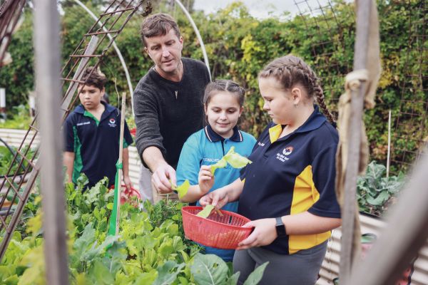 Garden Specialist Thomas Hayward with students